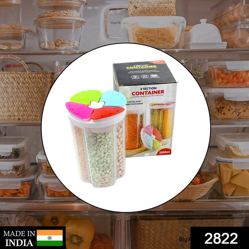 Airtight plastic food storage container with four compartments on a kitchen counter.