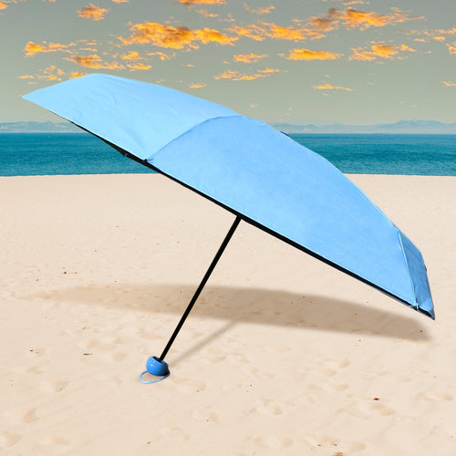 A sleek, black 5-Fold Umbrella neatly stored in its matching capsule case, ready for travel.