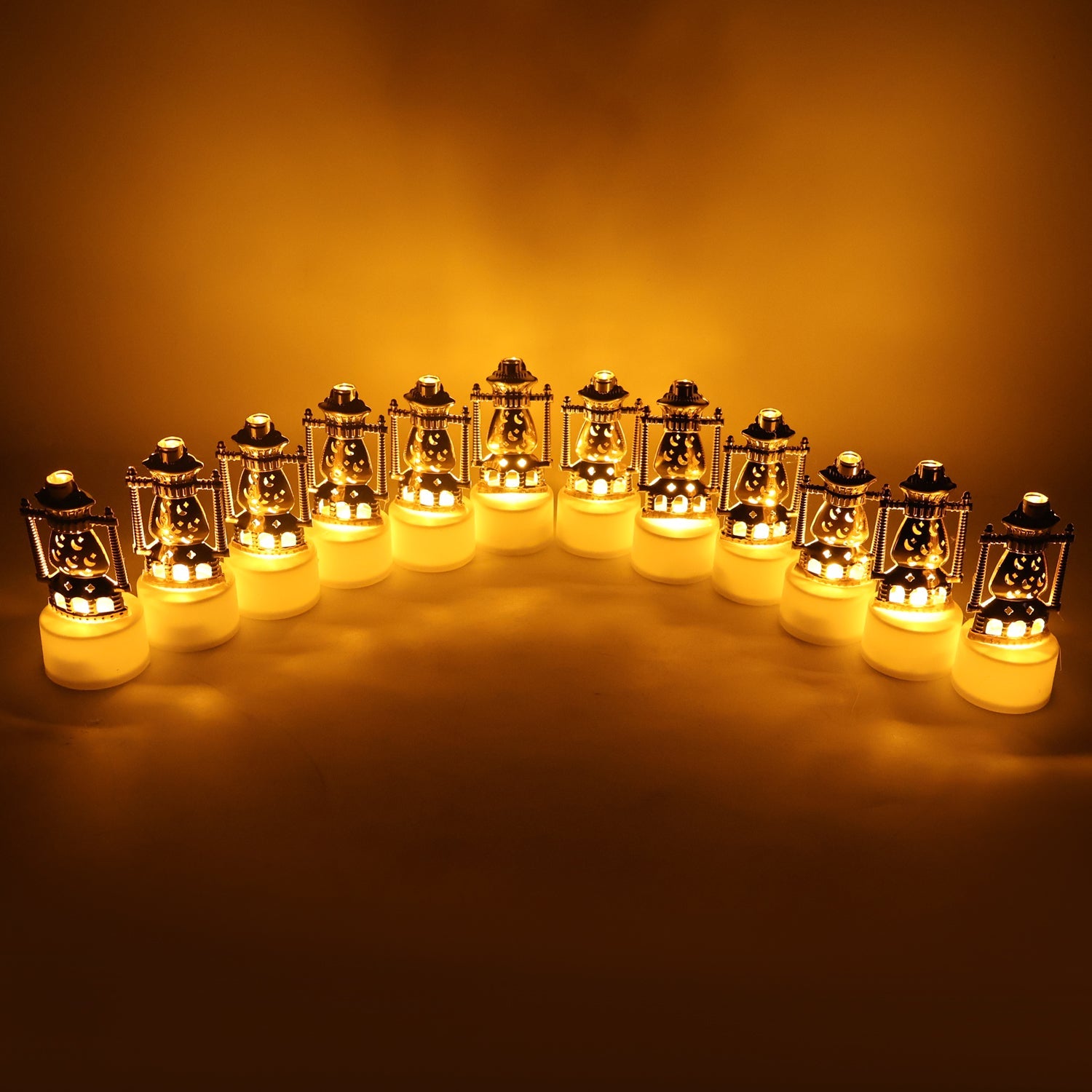 Set of lantern style flameless LED candles emitting warm yellow light