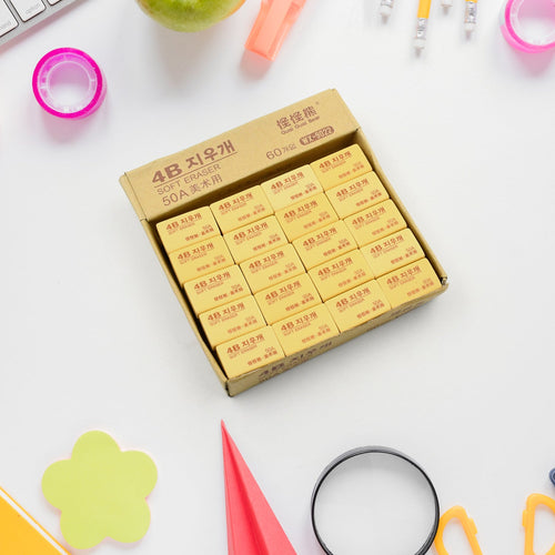 A stack of professional 4B drawing erasers in a 60-piece pack, perfect for artists.