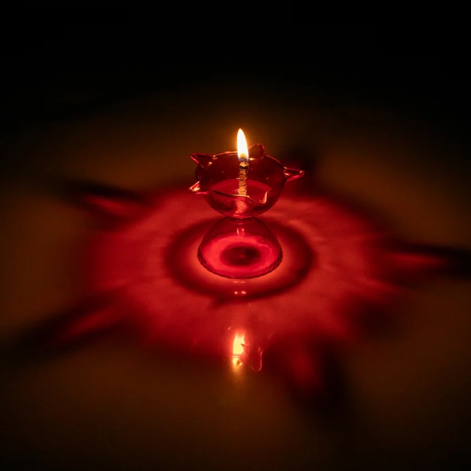 Overhead view of the complete 4-piece Reflection Diya Set, ready for festive use.