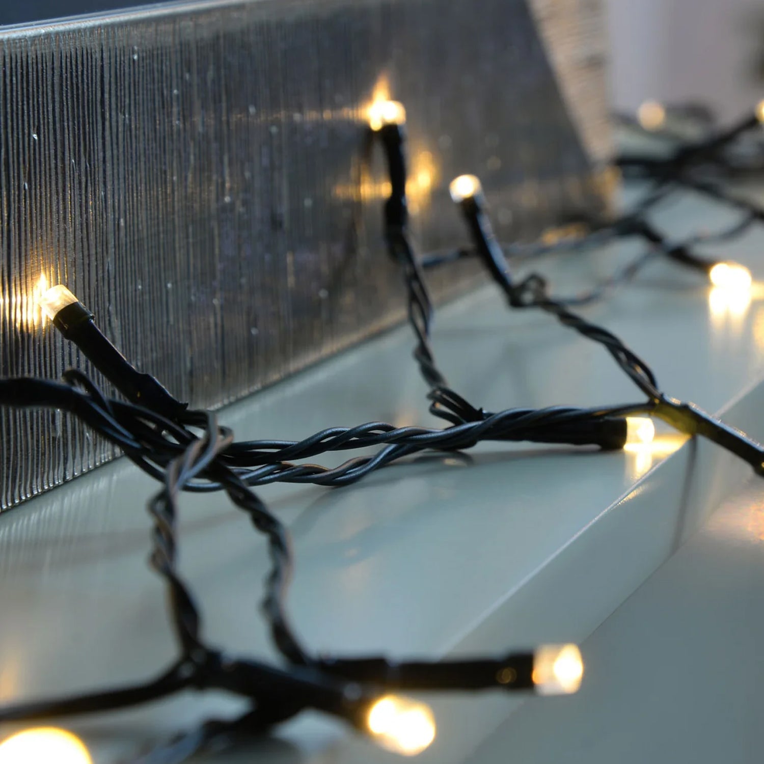 Cascading multi-color flower LED string lights on display.
