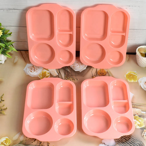 Top-down view of vibrant, multicolor 5-compartment food plates.