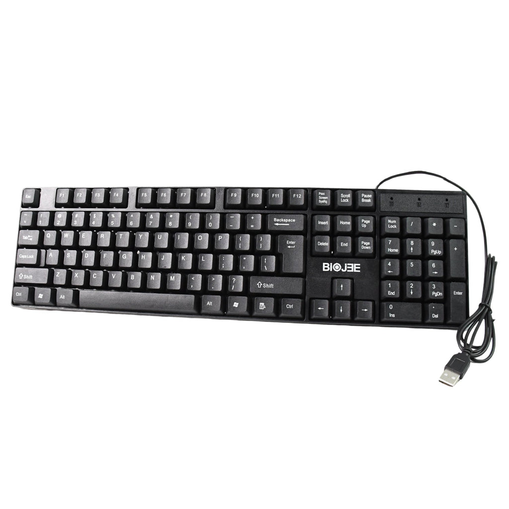 Person typing comfortably on the Wired USB Keyboard at a home office desk setup.