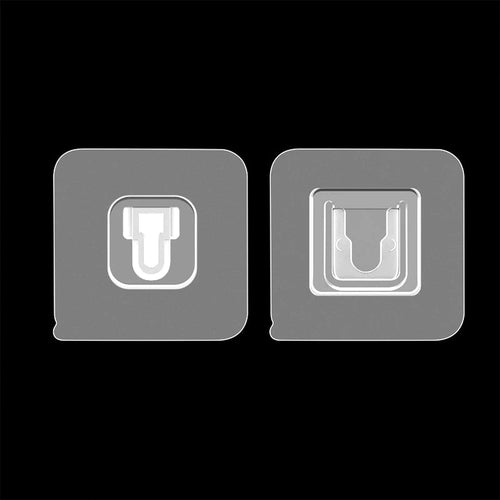 A pair of white heavy-duty adhesive wall hooks for home organization.