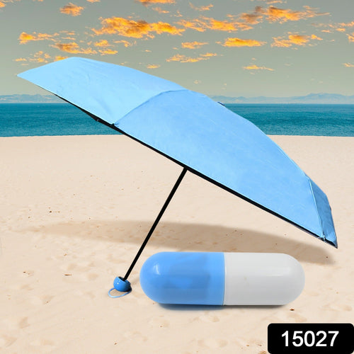 An open DrizzlePro compact umbrella providing ample rain protection in a city environment.
