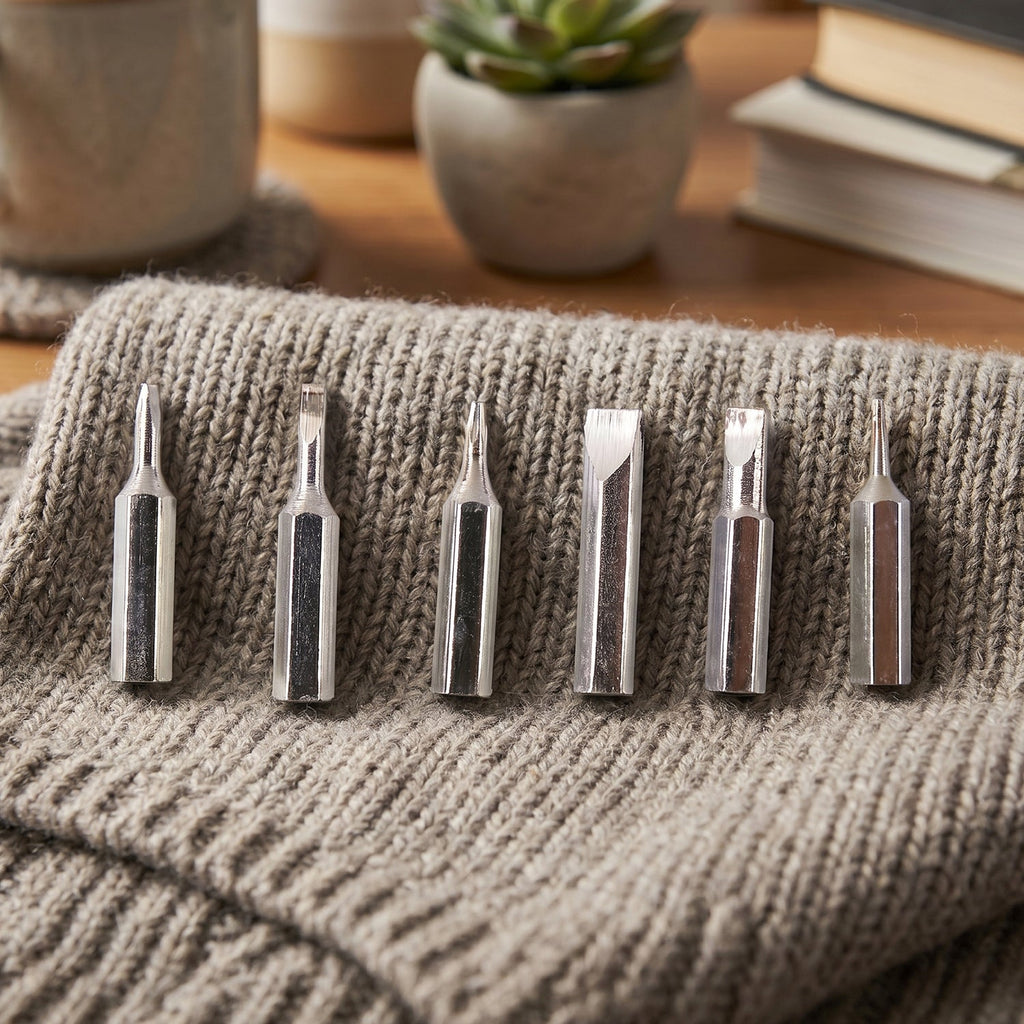 Close-up of precision screwdriver bits for detailed electronic repairs