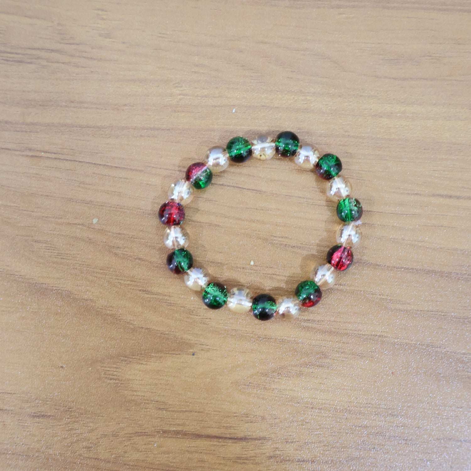 Live styling image of glossy multicolor bead stretch bracelet on wrist