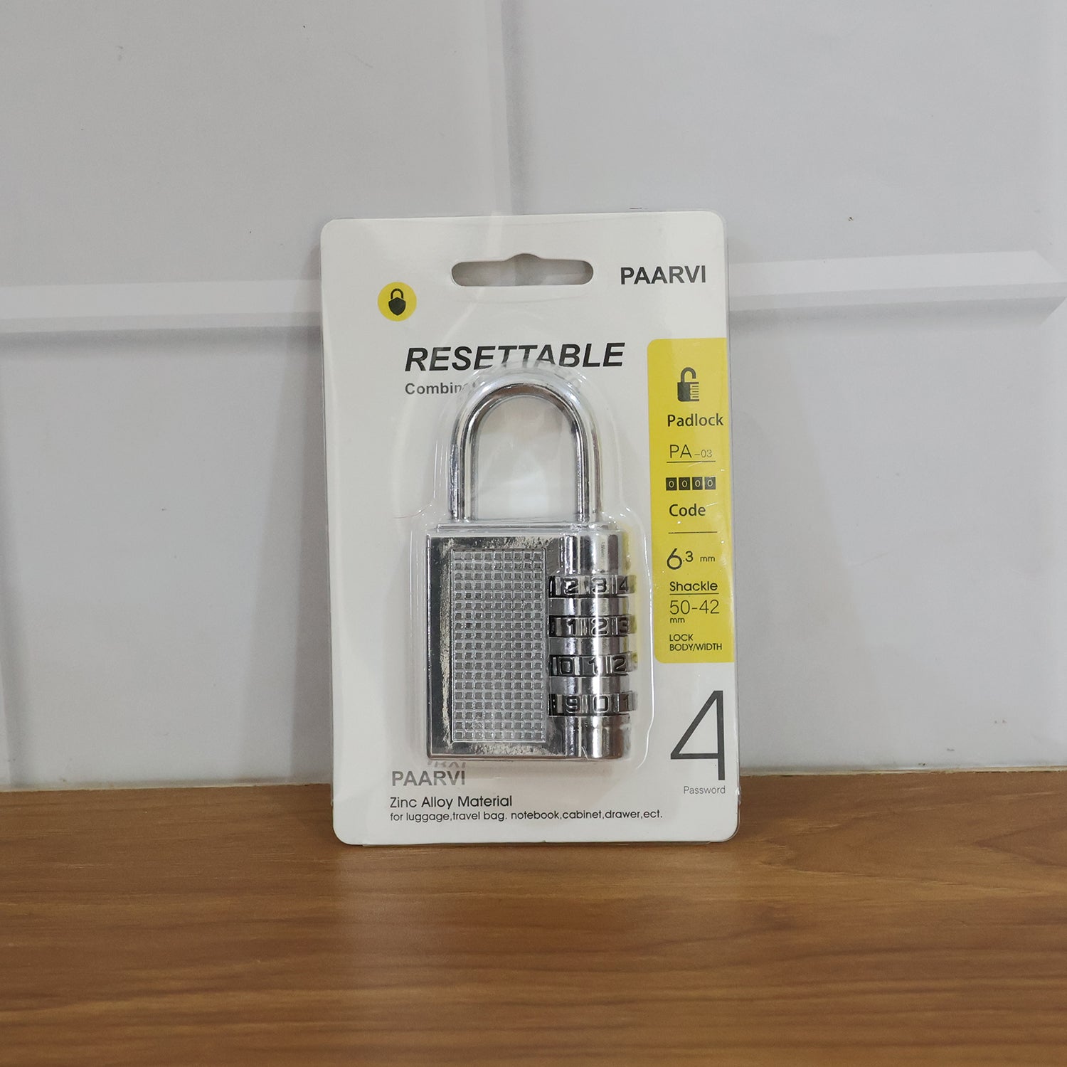 Resilient combination padlock shown in home and office setting