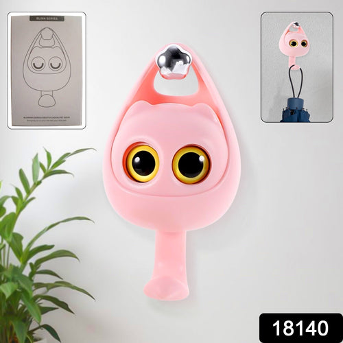 Close-up of the charming cat-shaped adhesive coat hook design.